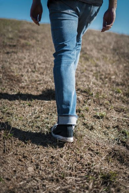 Revtown jeans on walking male model