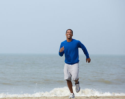 man running on the beach