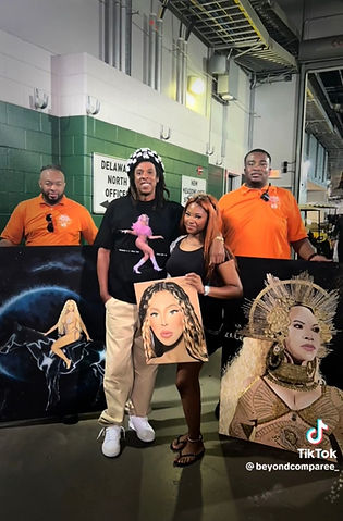 Jay Z and artist with her artwork