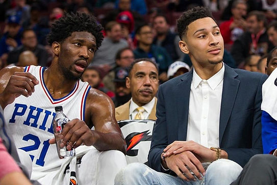 Joel Embiid (Left) Ben Simmons(Right) presumably thinking about how they could have two first round selections {AP PHOTO/CHRIS SZAGOLA}